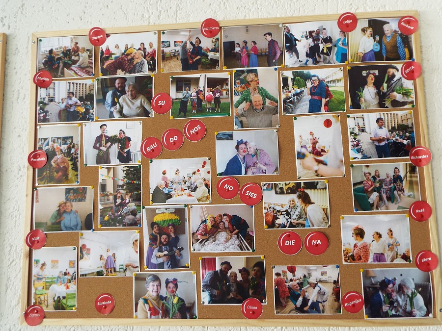 A big wallpaper joins together a collection of pictures of elderly people and RED NOSES Lithuania clowns 